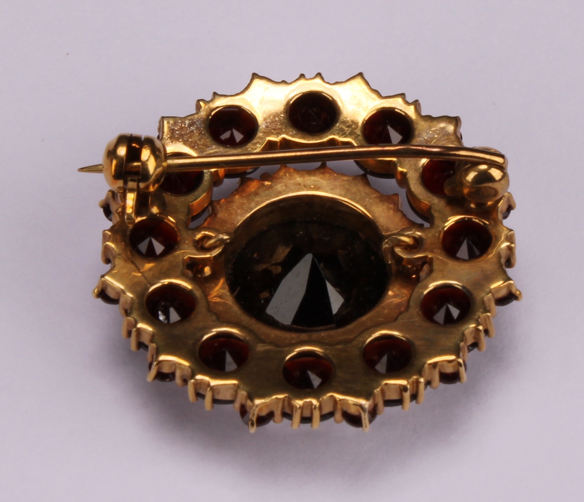 A Victorian style garnet and seed pearl target brooch, the large central round facet cut stone - Image 3 of 4