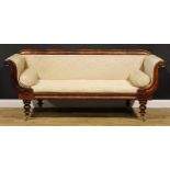 A George/William IV mahogany lyre arm sofa, stuffed-over upholstery, squab cushion, turned legs,