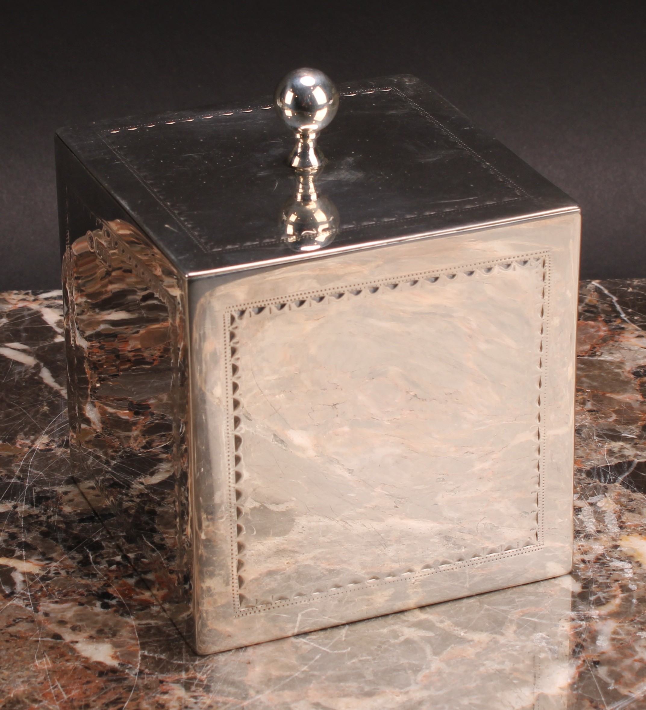 An Edwardian silver cube tea caddy, of George III design, bright-cut engraved wrigglework borders,