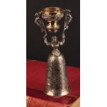 A Continental silver wager cup, of Renaissance figural design, 21.5cm high, apparently unmarked,