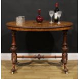 A Victorian Irish walnut and marquetry stretcher table, oval top with carved edge, turned supports