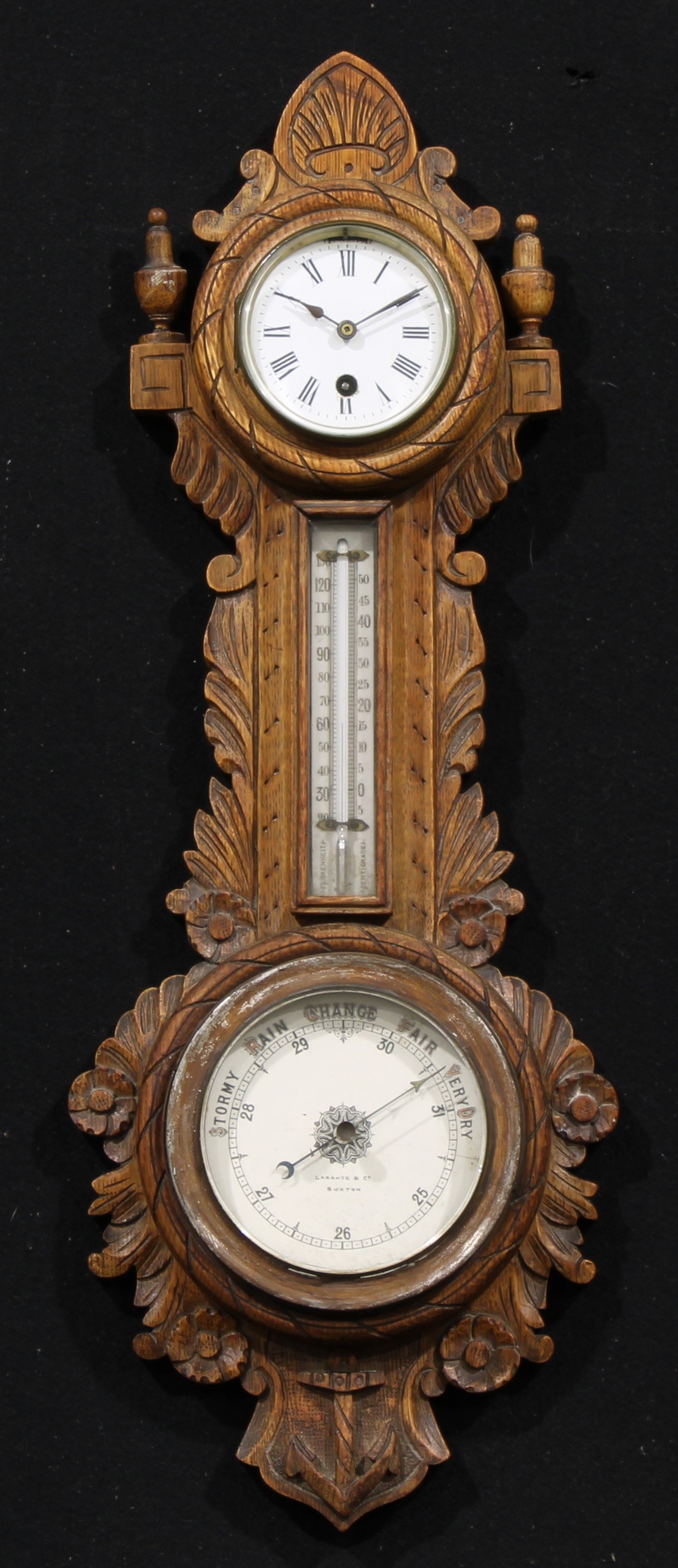 A late Victorian/Edwardian oak wheel weather station timepiece, 8cm circular clock dial inscribed