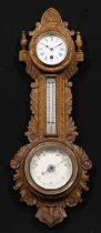 A late Victorian/Edwardian oak wheel weather station timepiece, 8cm circular clock dial inscribed