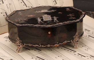 An Edwardian silver mounted tortoiseshell and pique shaped oval casket, hinged cover inlaid with a