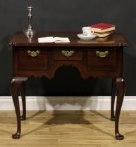 A George III red walnut and mahogany lowboy, moulded rectangular top with trefid foreangles above