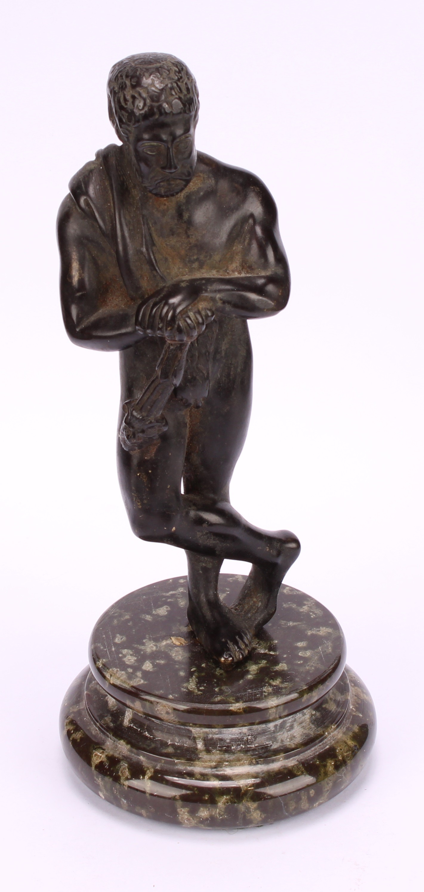 A late 19th century Grand Tour patinated bronze, of Hercules, draped with a pelt, masked club in - Image 2 of 4