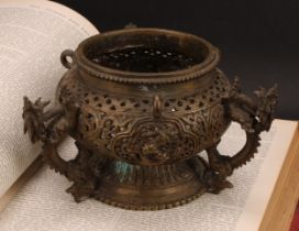 A Chinese bronze hanging censer, pierced and cast with dragons, temple lions and scrolls, 18.5cm