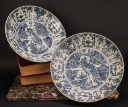 A pair of 17th century Chinese shipwreck porcelain dishes, painted in tones of underglaze blue