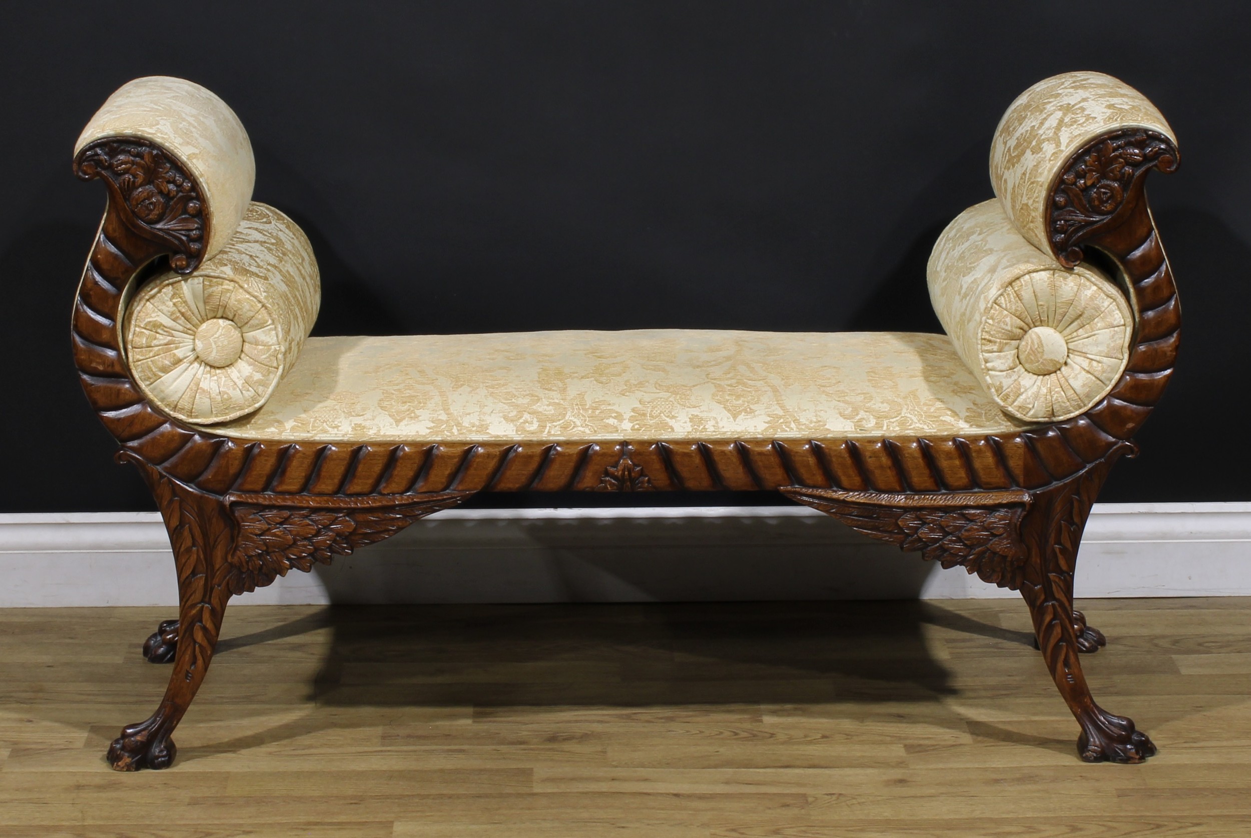 An American Empire Revival neoclassical mahogany window seat, Récamier-form arms carved as