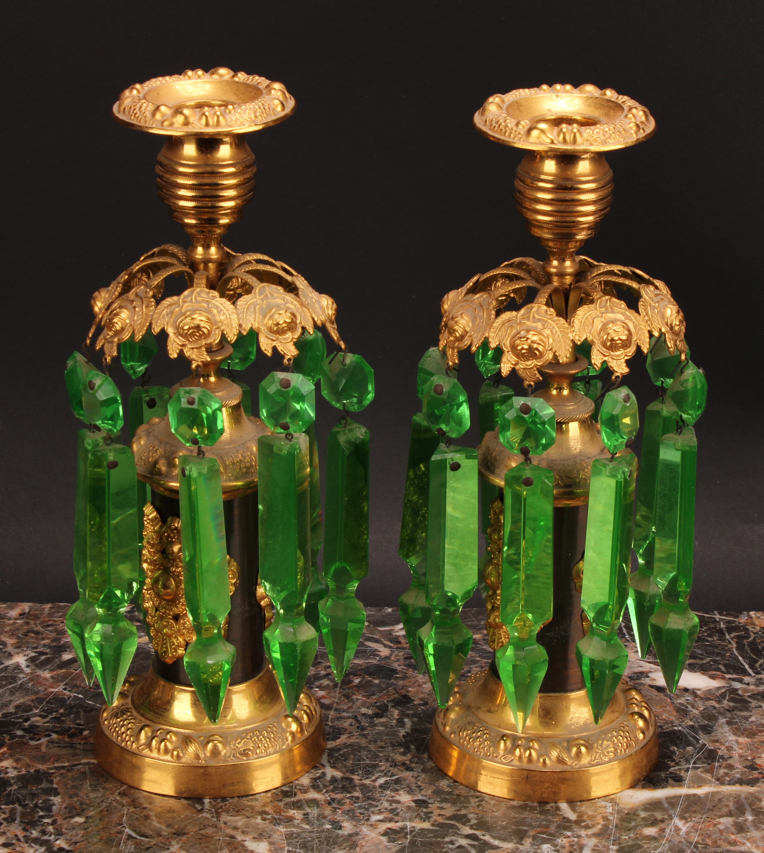 A pair of 19th century dark patinated and gilt metal mantel candle lustres, campana sconces, green