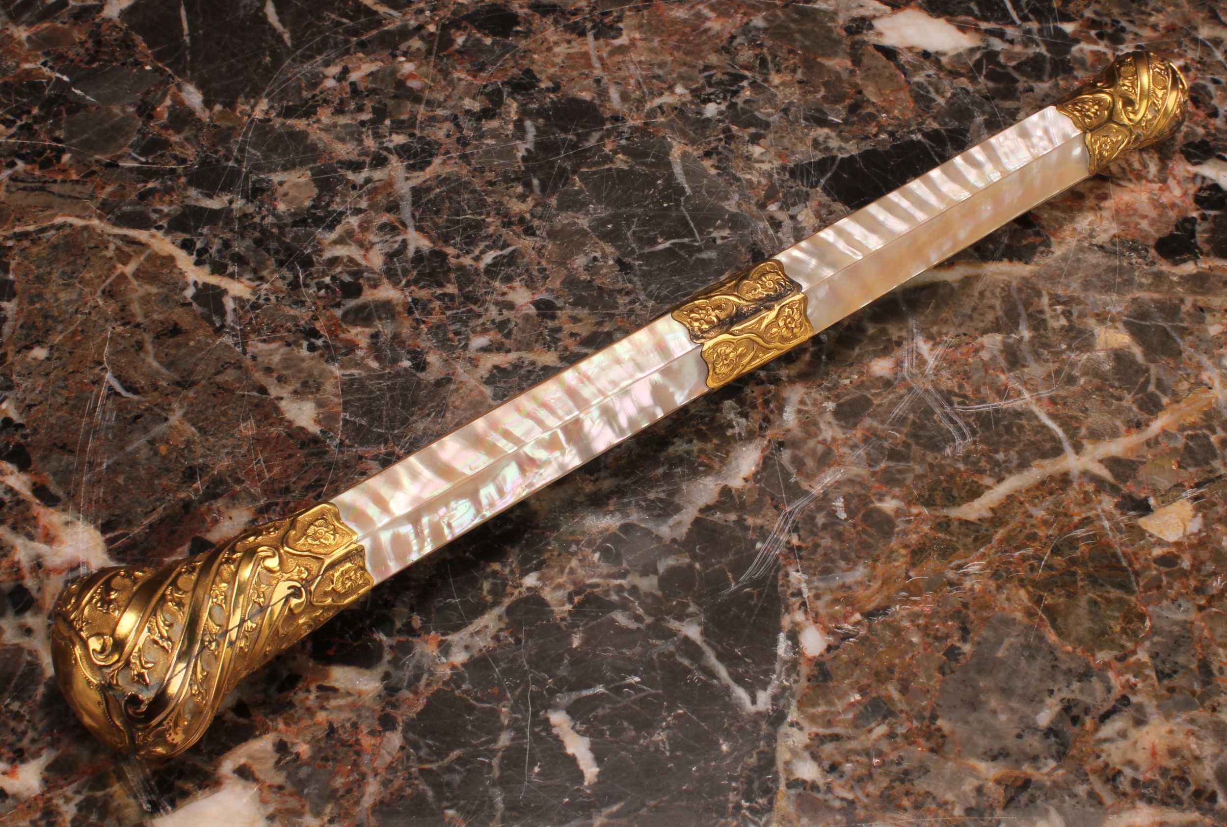 A 19th century gilt metal mounted mother of pearl parasol handle, the fittings spirally fluted and - Image 2 of 2