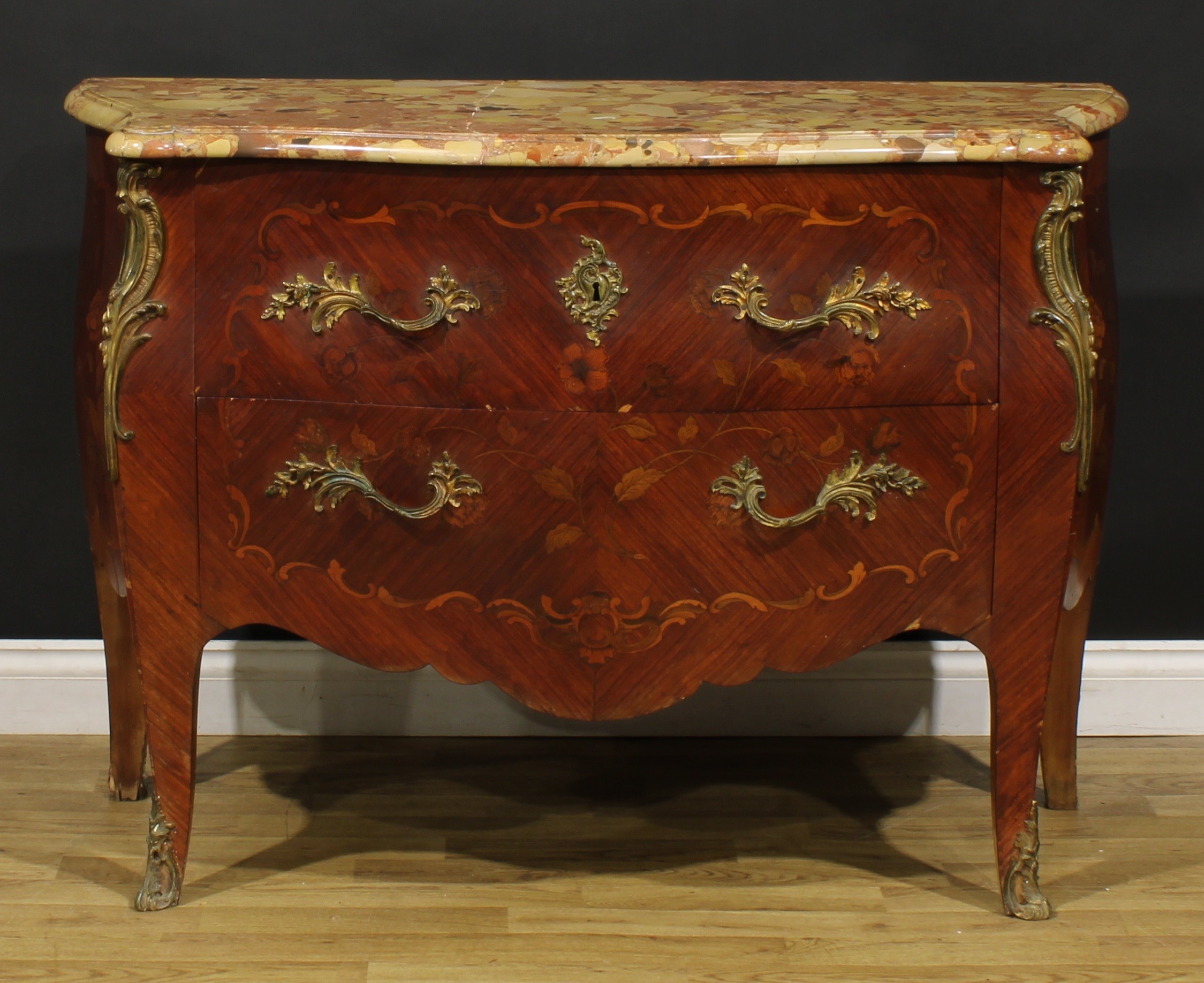 A Louis XV Revival gilt metal mounted kingwood and marquetry bombe commode, marble top above two