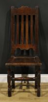 A William & Mary oak side chair, shaped cresting rail, panel seat, turned and blocked forelegs,