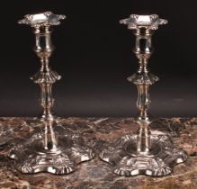 A pair of William IV silver table candlesticks, detachable nozzles, knopped pillars, shaped circular