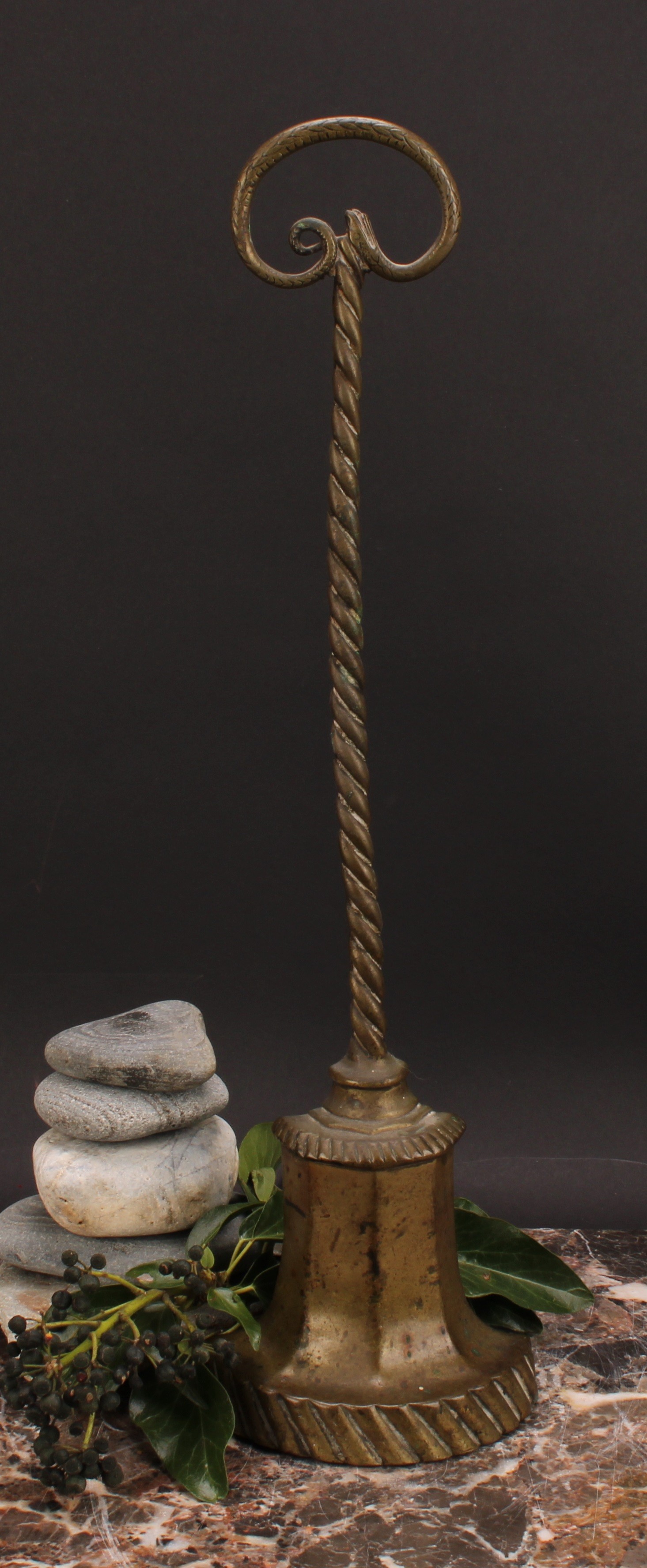 A 19th century brass and cast iron bell shaped door stop or porter, the handle cast as a serpent,