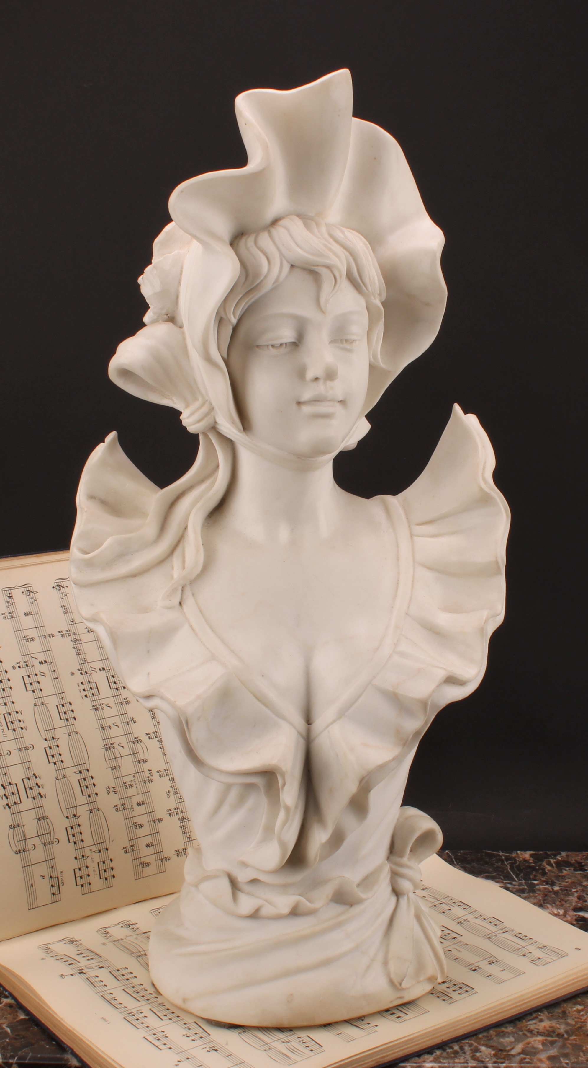 Continental School, a white marble bust, à la mode maiden, 57cm high
