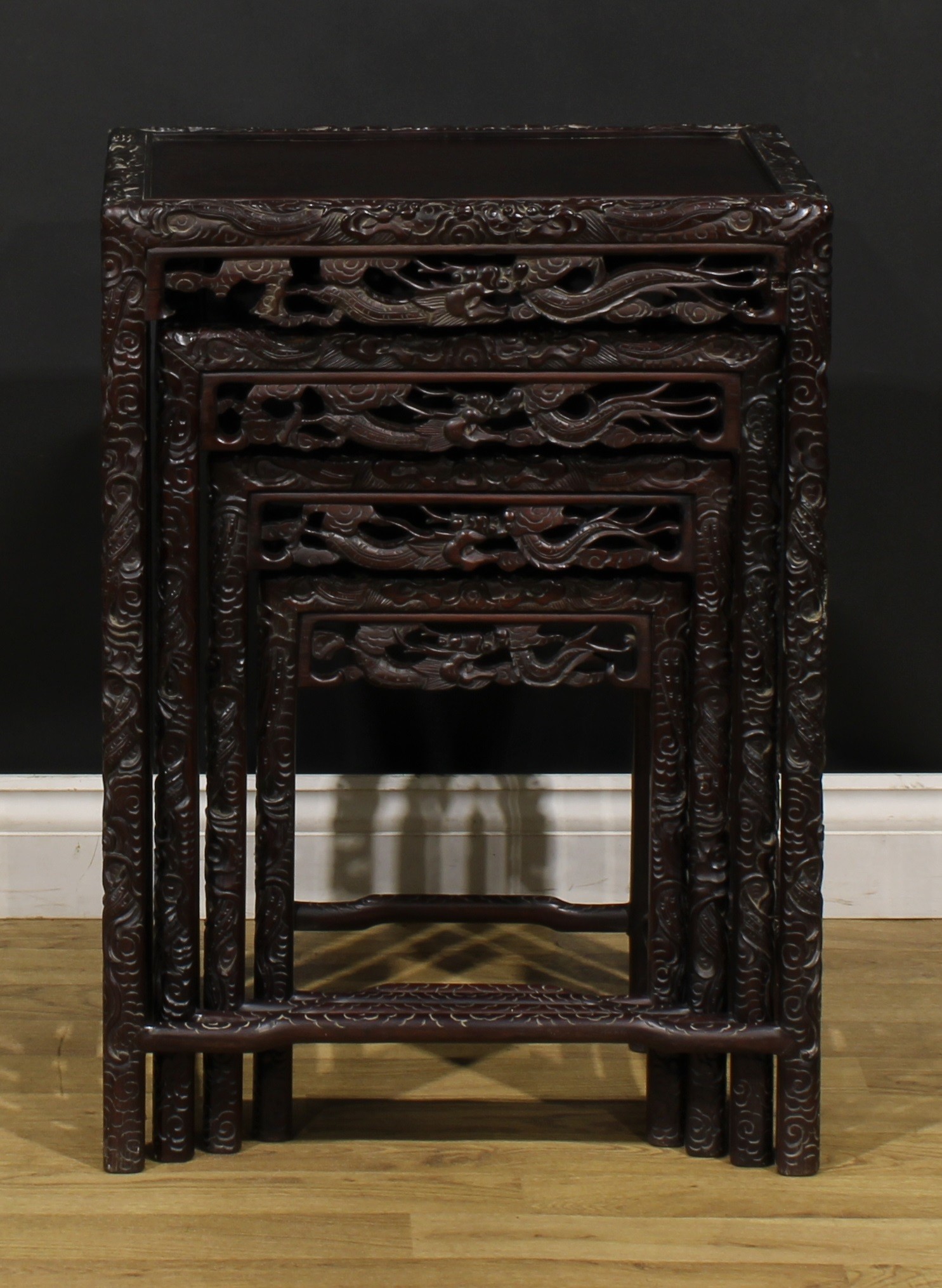 A set of Chinese hardwood quartetto tables, each carved throughout with dragons, the largest 70. - Image 6 of 6