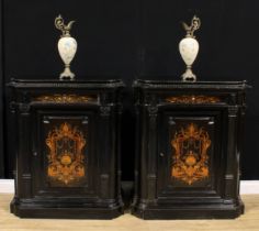 A pair of 19th century Continental ebonised and marquetry pier cabinets, each with a concave moulded