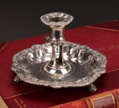 An unusual George II silver shaped circular chamber stick, fluted gadrooned, stiff leaf and shell