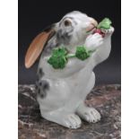 A Continental porcelain model, of a rabbit, on hind legs eating grapes from a vine, 15.5cm high, c.
