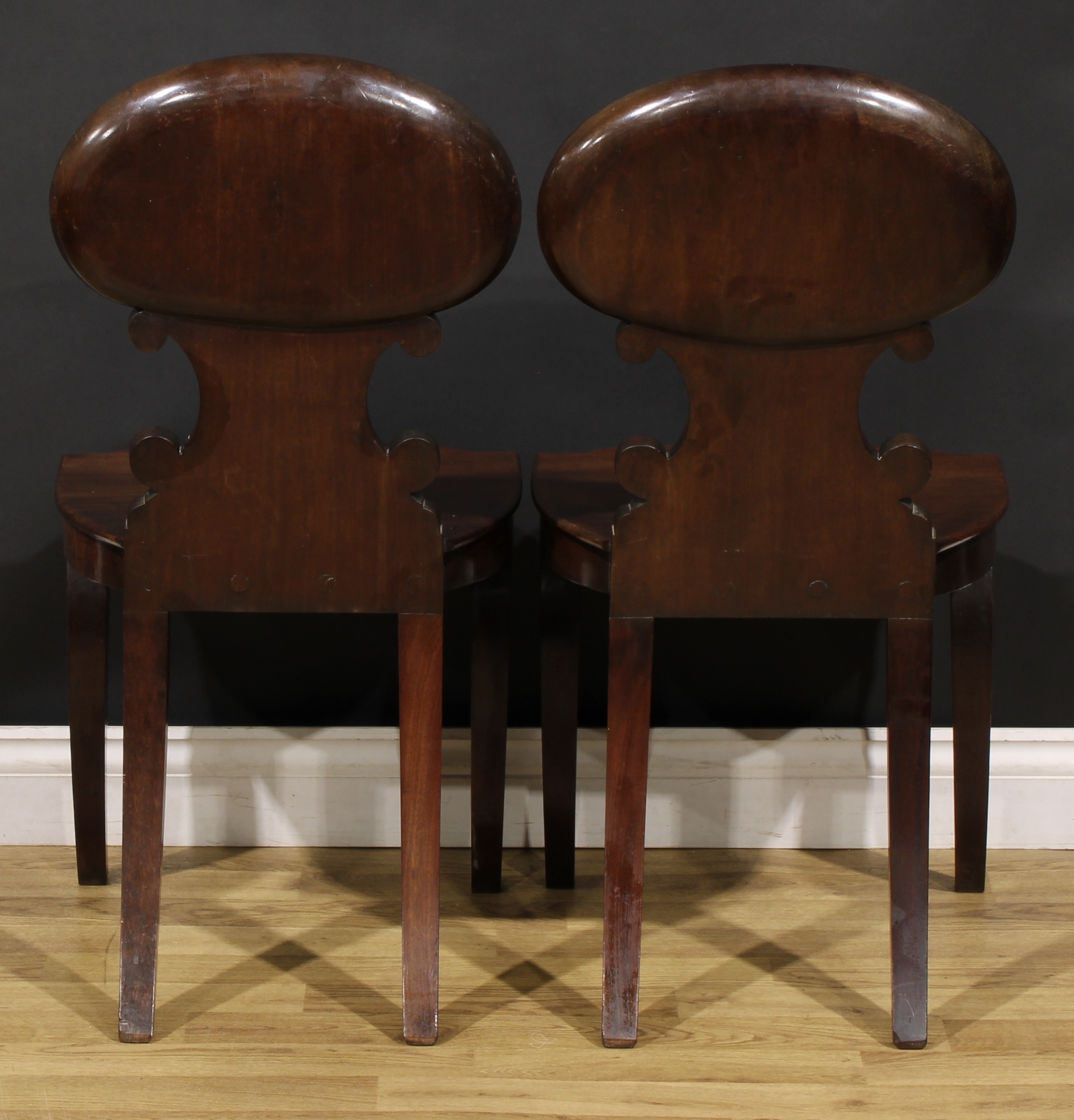 A pair of Post-Regency mahogany hall chairs, in the manner of Gillows of Lancaster and London, - Image 4 of 4