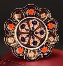 A Royal Crown Derby 1128 Imari pattern lobed circular plate, shaped moulded borders, 22.5cm