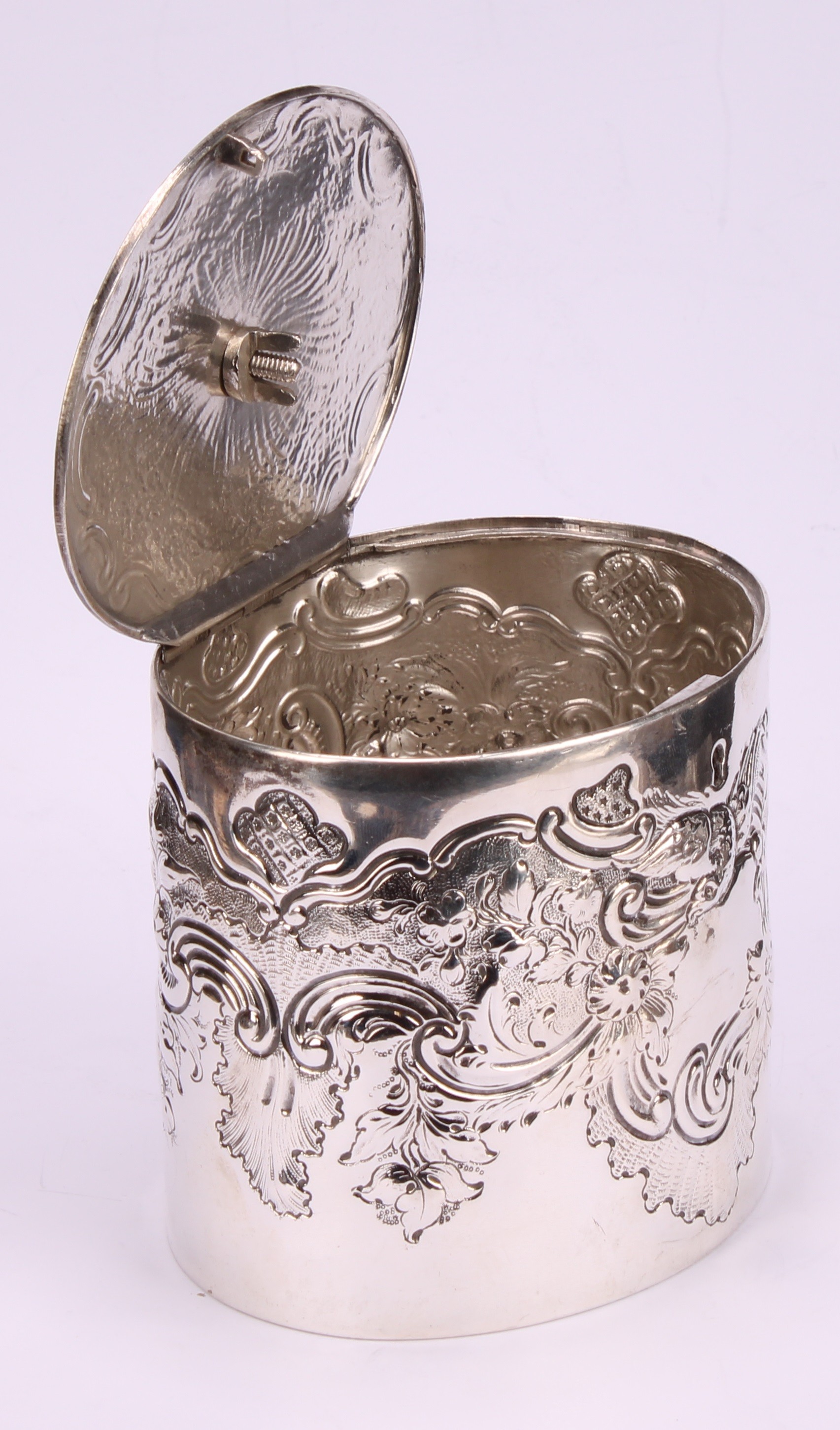 A George III oval tea caddy, chased with birds, flowers and scrolling leaves, flush-hinged cover - Image 4 of 5