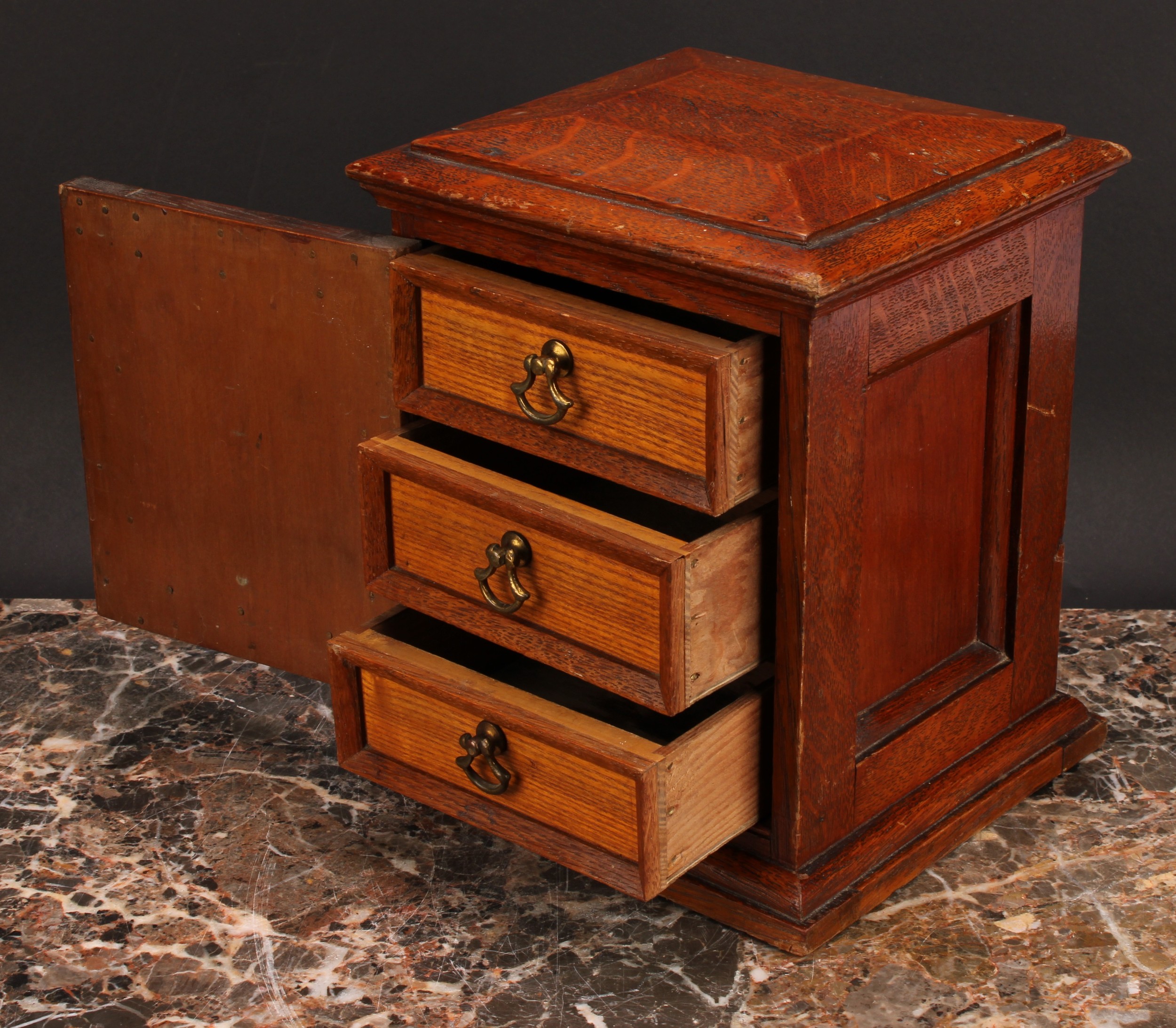 A Victorian oak table top cabinet, sarcophagus top above a panelled door enclosing three collector's - Image 4 of 5