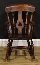 A late Victorian beech child’s rocking chair, 72cm high, 44cm wide, the seat 27cm wide and 30cm