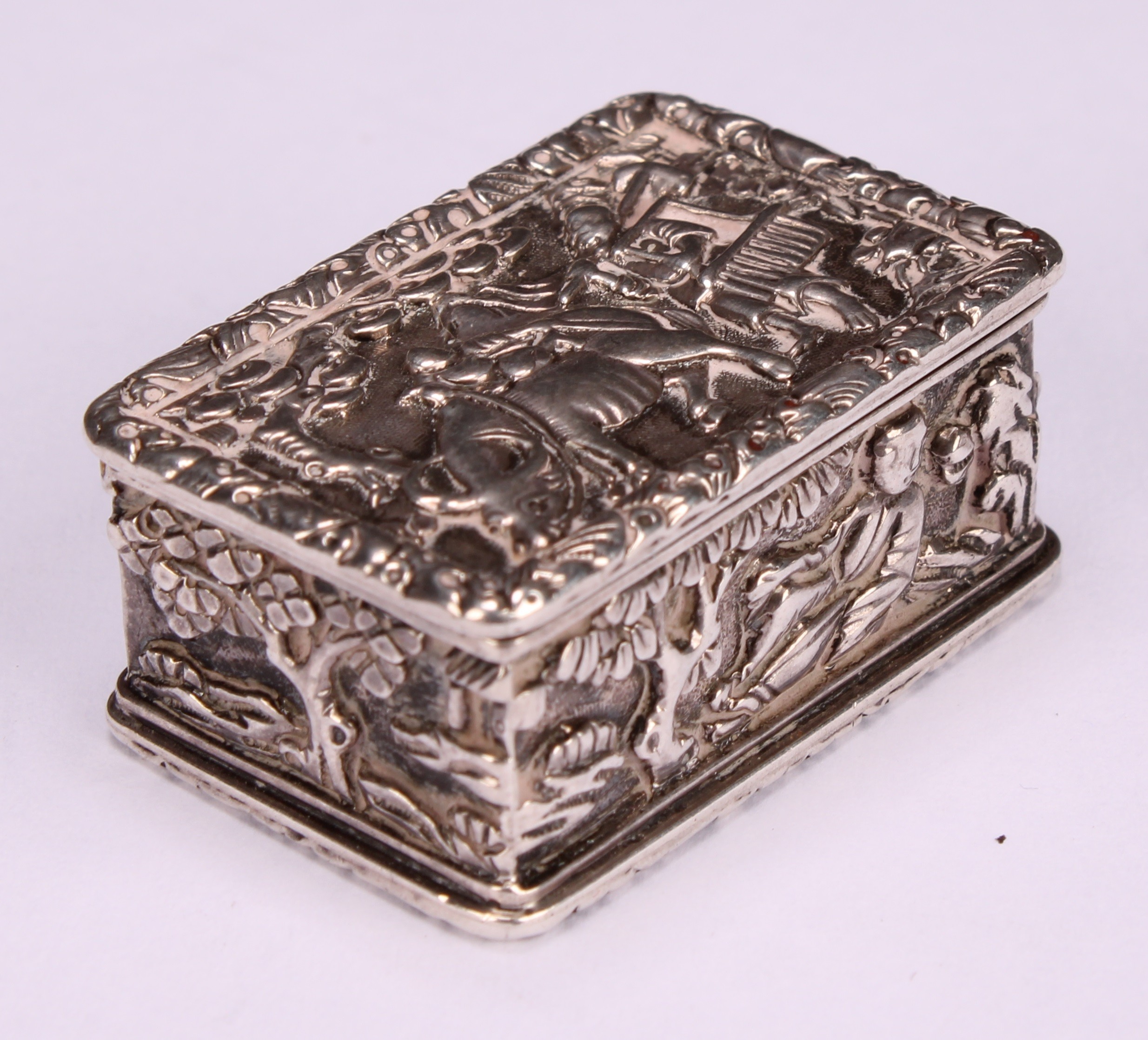 A Chinese silver rectangular vinaigrette, in relief with young boys in landscapes and riding a - Image 3 of 5