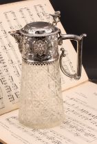 A Victorian silver mounted hobnail-cut clear glass claret jug, hinged cover surmounted by a lion