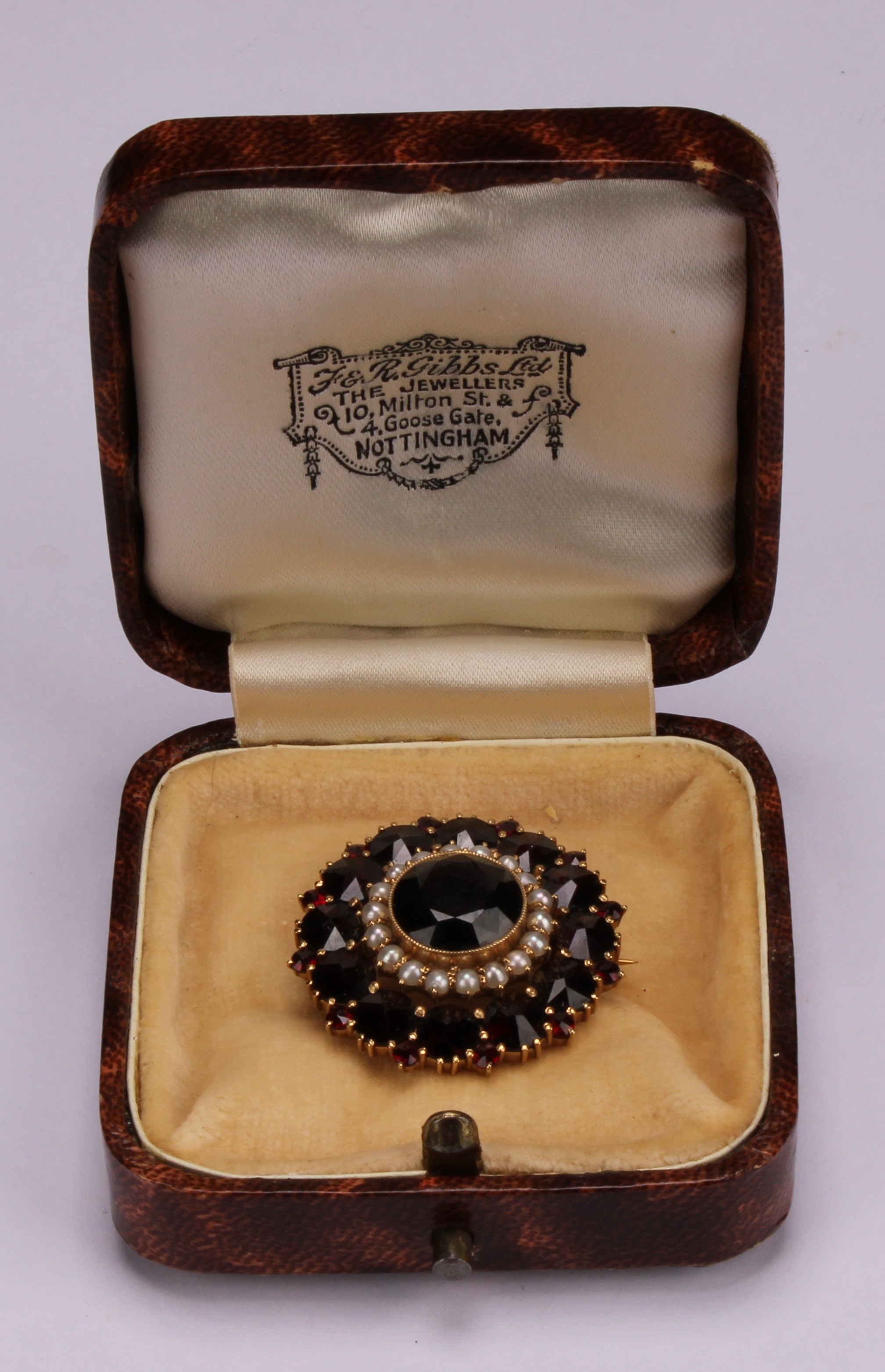 A Victorian style garnet and seed pearl target brooch, the large central round facet cut stone - Image 4 of 4