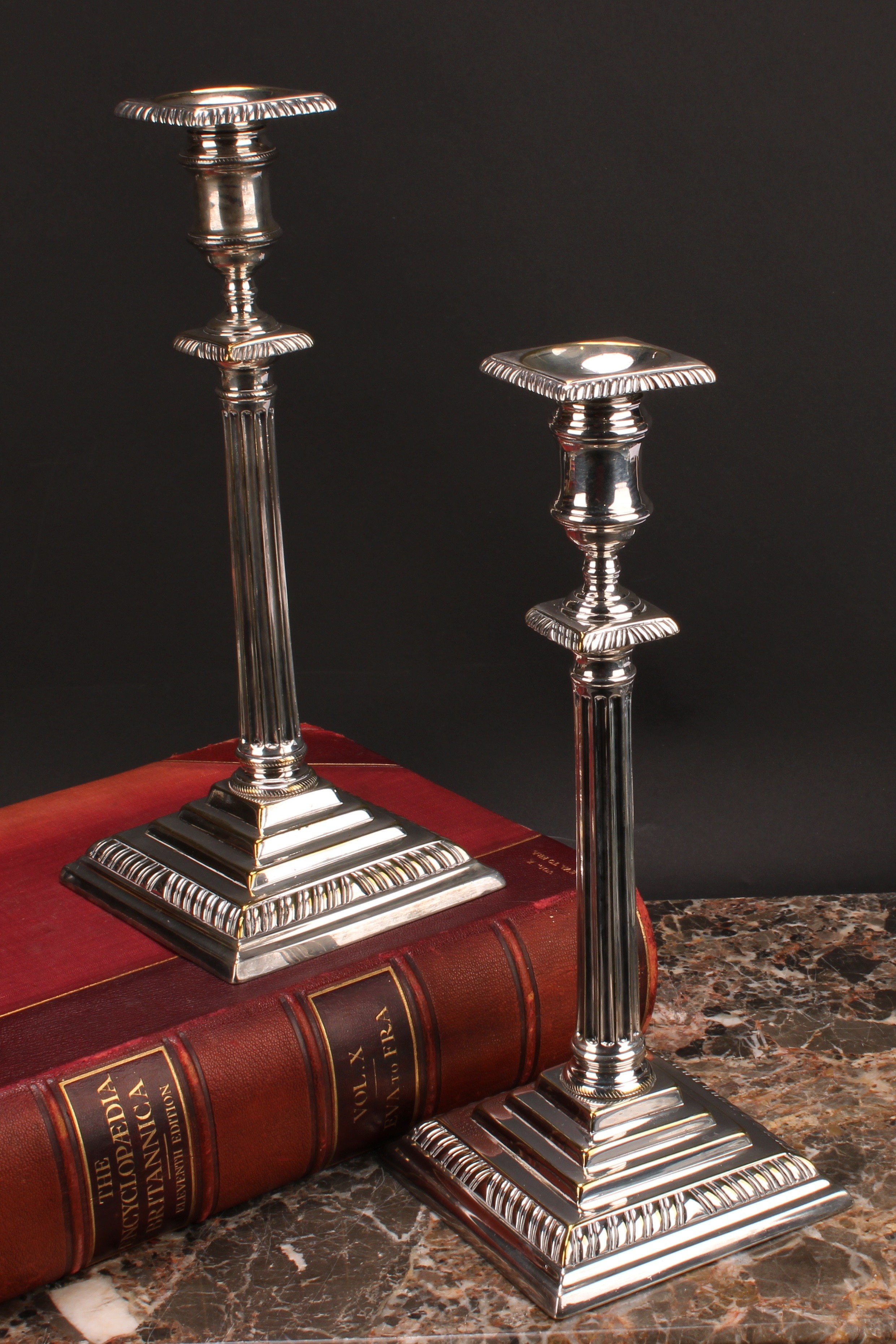 A pair of George III 'Teutonic' German silver plated or paktong table candlesticks, detachable