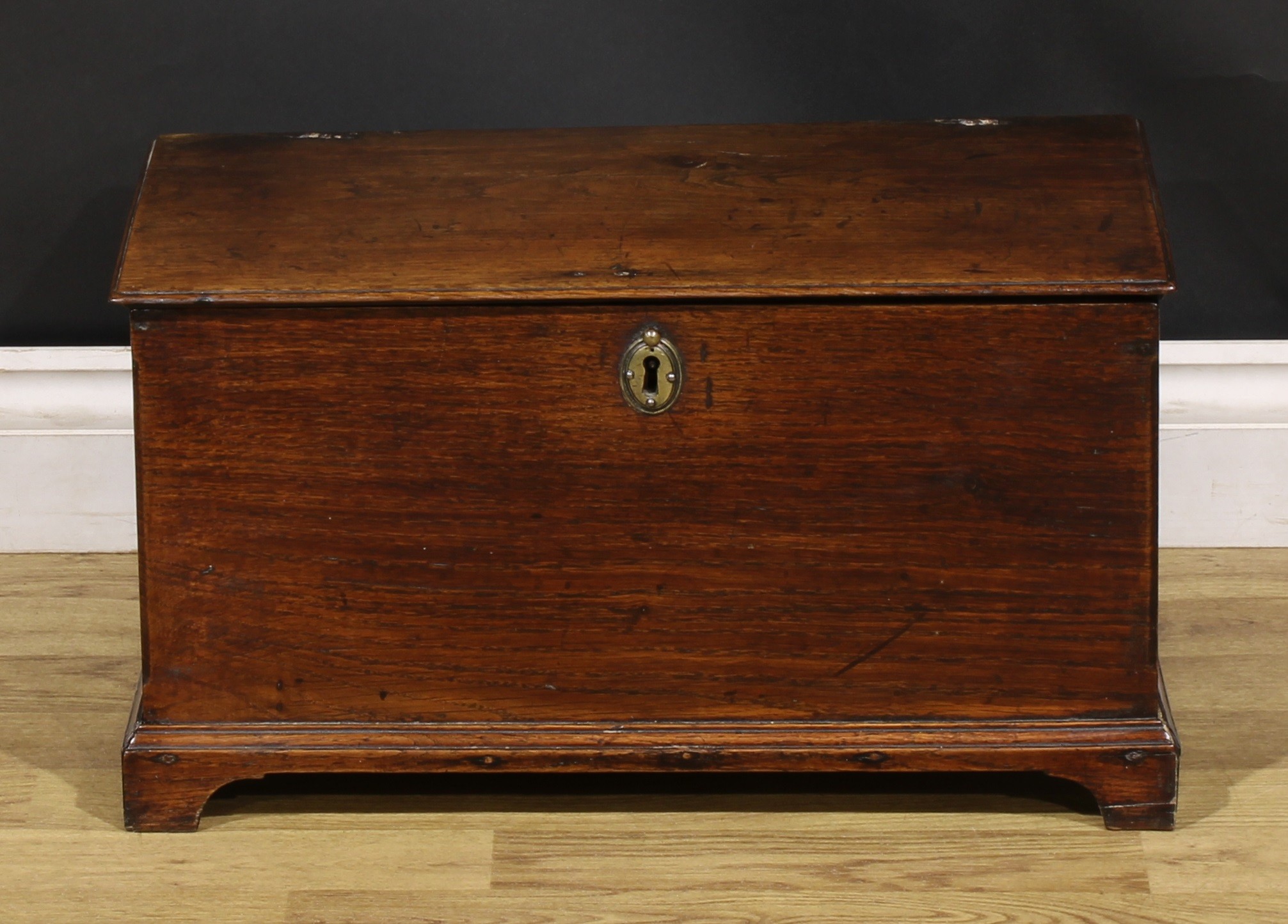 A George III oak table box six plank boarded table box, hinged cover, bracket feet, 29.5cm high,