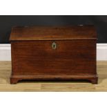 A George III oak table box six plank boarded table box, hinged cover, bracket feet, 29.5cm high,