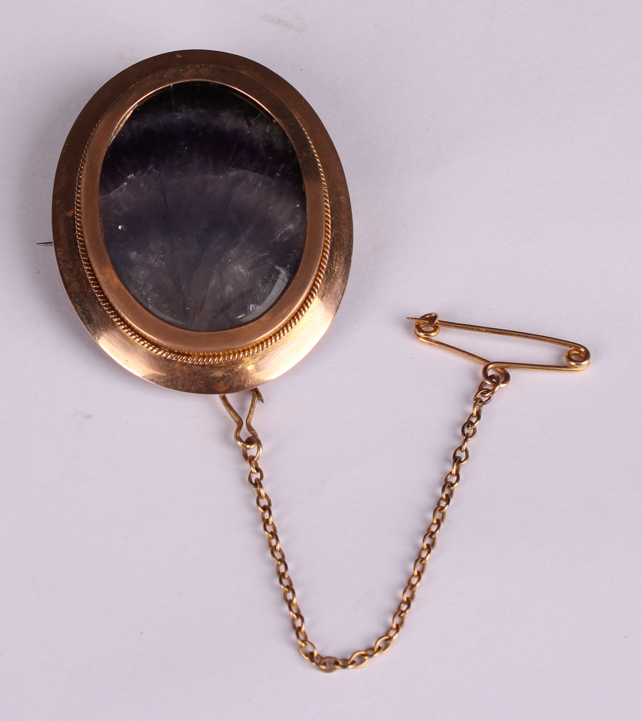 A late 19th century 9ct rose gold Derbyshire Blue John polished oval brooch, the veined panel backed - Image 2 of 4