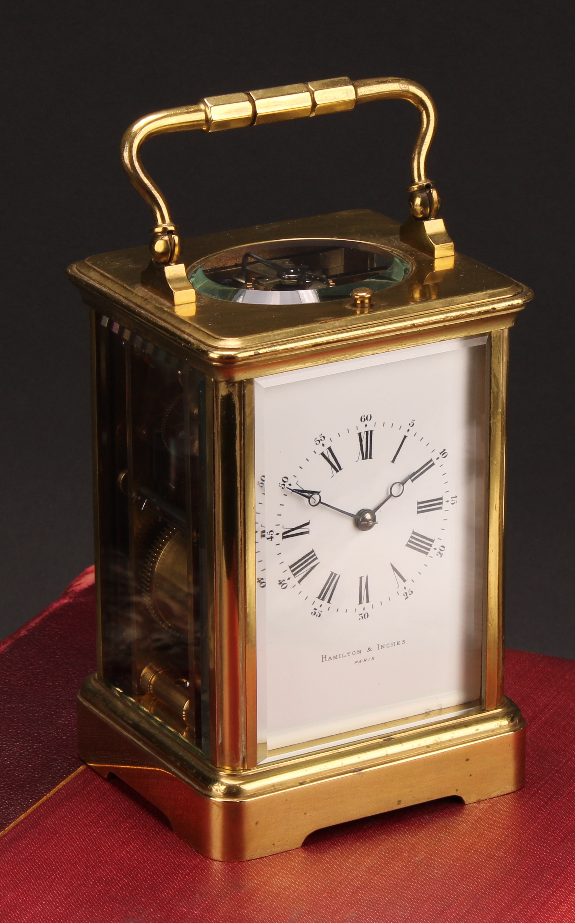 An early 20th century brass repeater carriage clock, 6cm enamel dial inscribed HAMILTON & INCHES