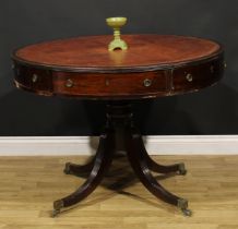 A Post-Regency mahogany drum table, circular top with reeded edge and inset tooled and gilt