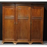 An early 20th century mahogany break-centre triple wardrobe, by John Jones & Sons, Derby, (fl.c.