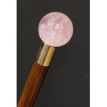 A rose quartz mounted walking stick, globular pommel, the gilt metal pommel inscribed Martin Glaser,