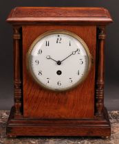 An early 20th century French oak mantel clock, 12cm circular enamel dial inscribed with Arabic