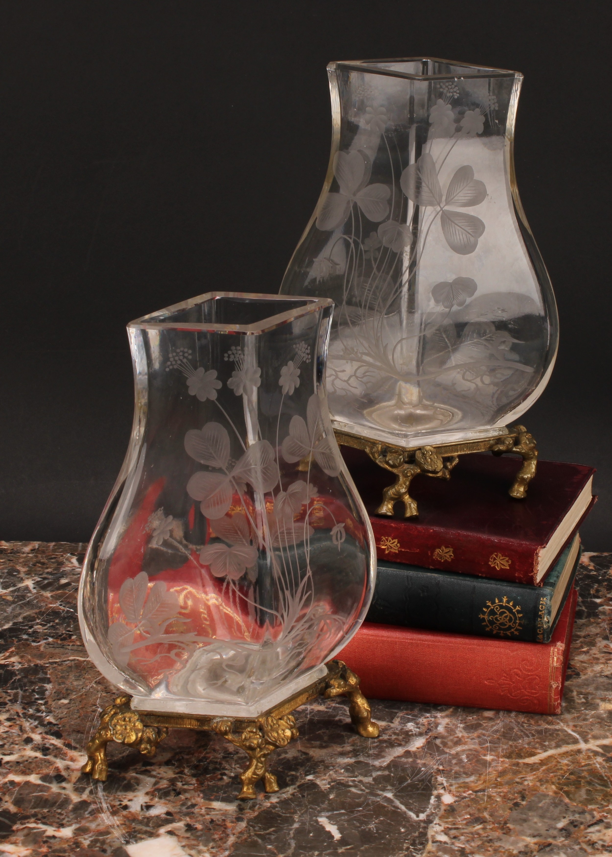 A pair of Continental ormolu mounted clear glass vases, each etched in the Art Nouveau taste with