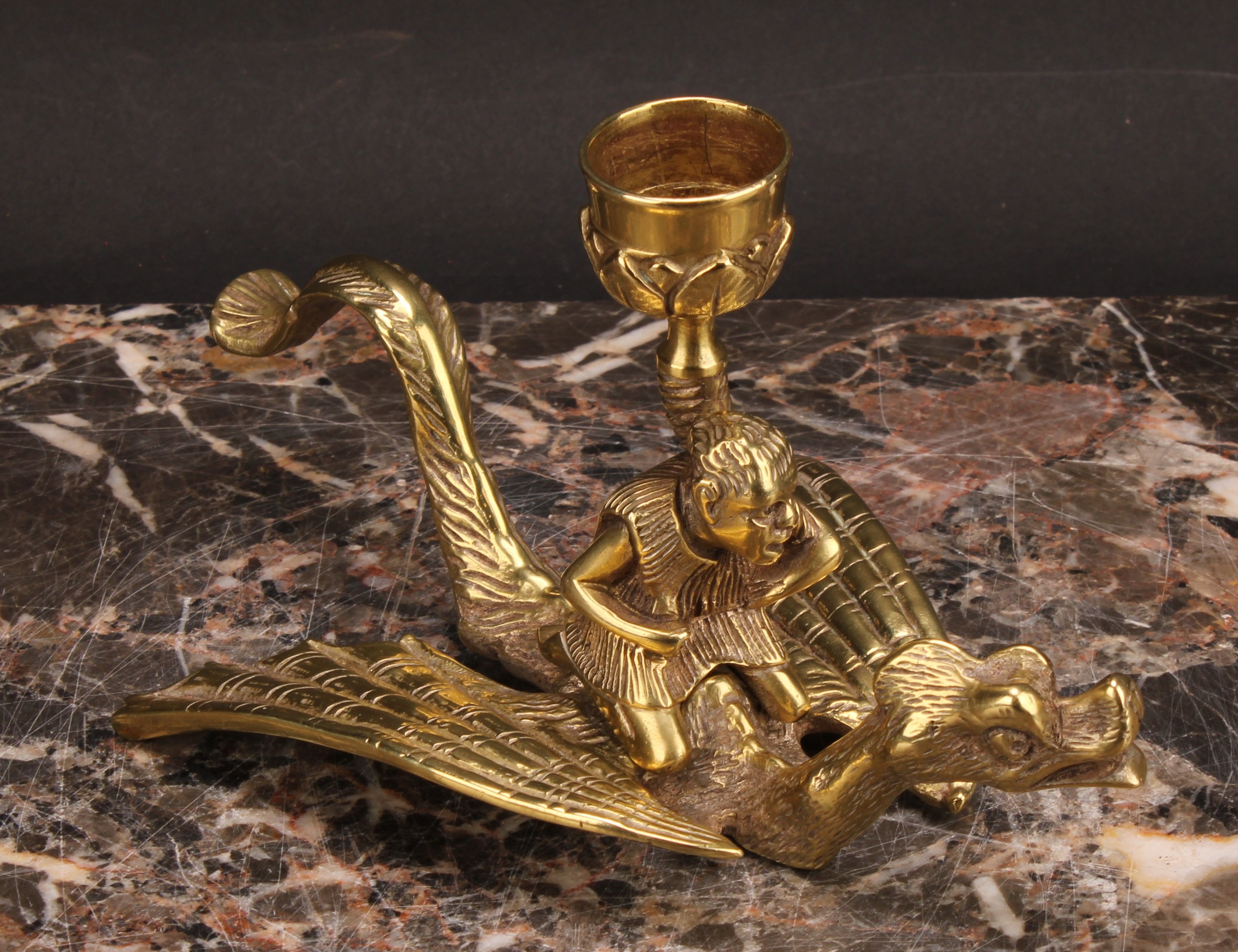 A 19th century brass chamberstick, cast as a figure riding a dragon, 9cm high - Image 3 of 4