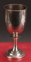 A Victorian silver pedestal goblet, bright-cut engraved with lotus within wrigglework arches,