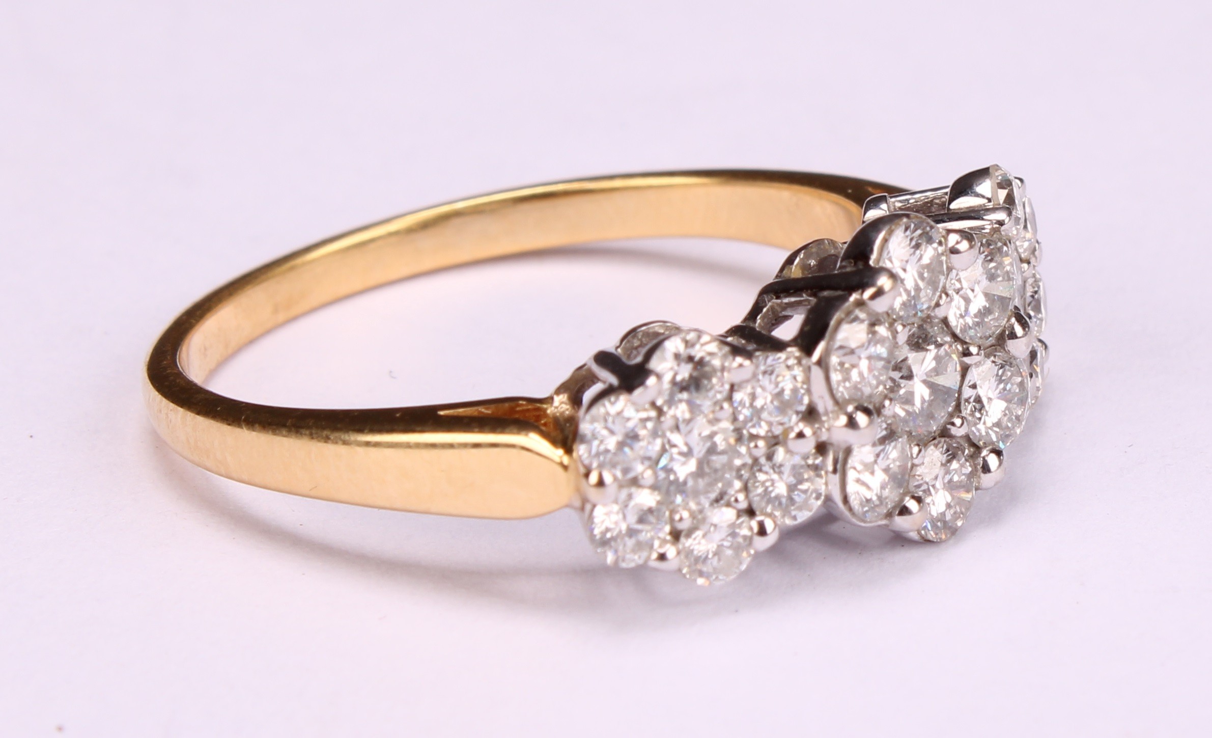 A diamond cluster ring, three graduated flowerhead cluster set with twenty one round brilliant cut - Image 2 of 5
