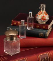 An associated pair of silver and guilloche enamel mounted rectangular glass scent bottles, the screw