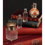 An associated pair of silver and guilloche enamel mounted rectangular glass scent bottles, the screw