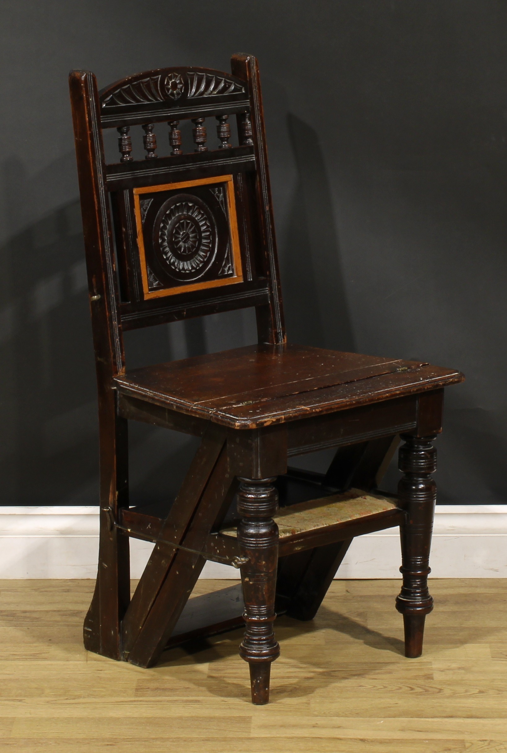 A late Victorian Aesthetic Movement metamorphic library step chair, spindle back with carved central - Image 2 of 6