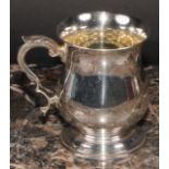 An Elizabeth II silver bell shaped mug, of George II design, quite plain, acanthus-capped double