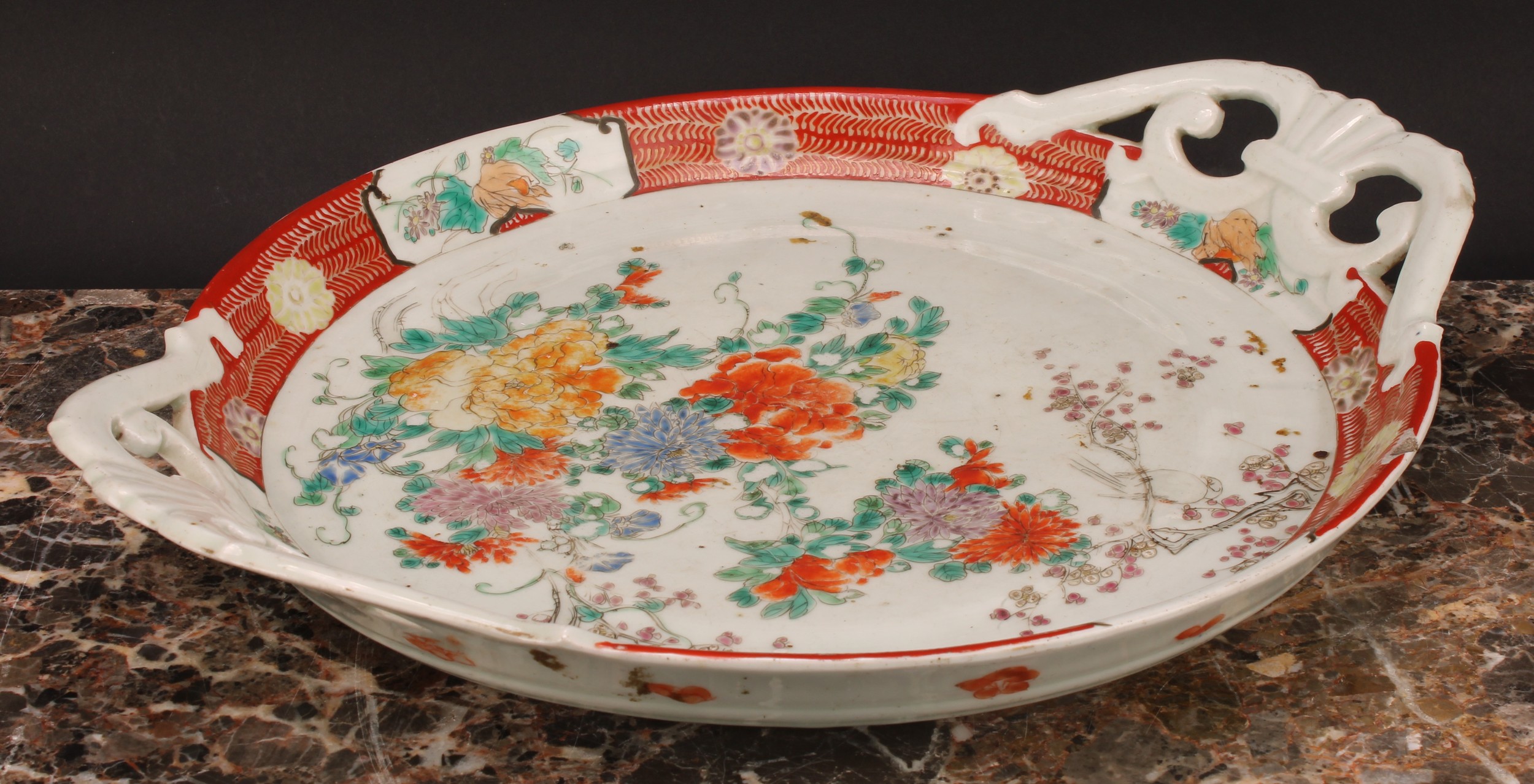 A Japanese two-handled circular tray, painted in polychrome with flowers, 41cm wide, Meiji period - Image 3 of 3